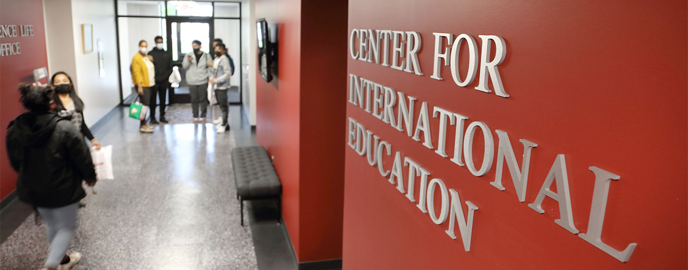 Students walk in front of the Center for International Education